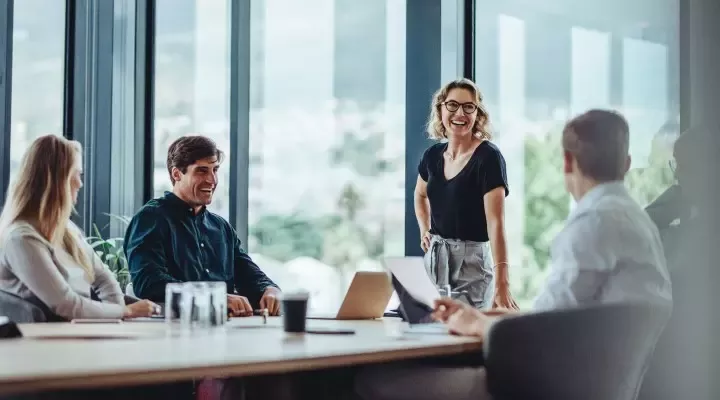 People laugh during meetings.