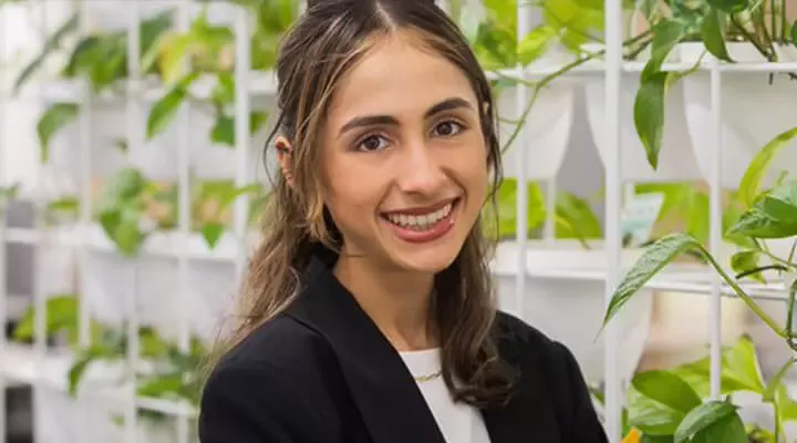 young woman on the background of shelves with plants