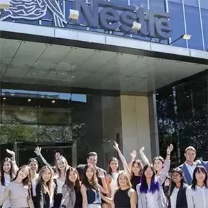 Employees gathered outside the Nestlé Sydney office building entrance
