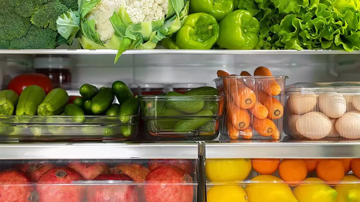 Fresh fruits and vegetables stored in a refrigerator to reduce household food waste